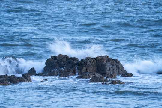 wave and rock in ocean