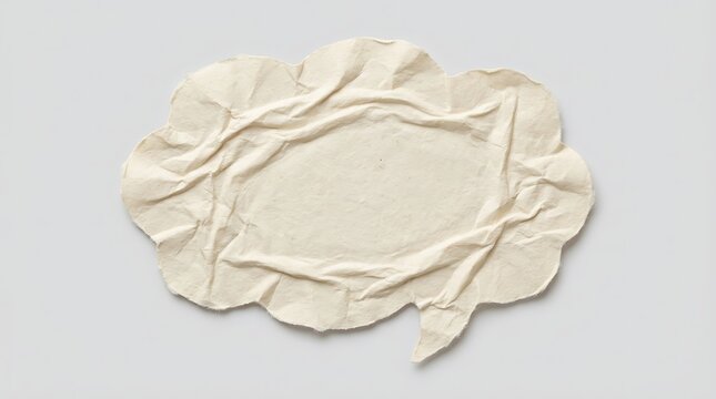 Creased white paper speech bubble isolated on a plain background with wrinkled