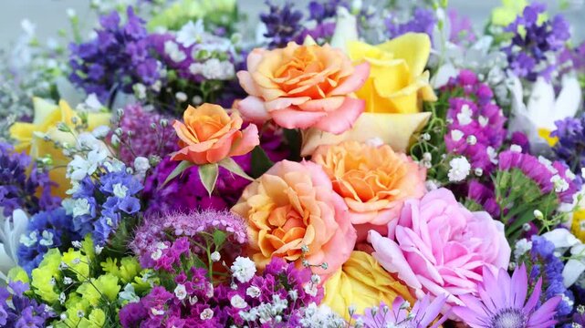 Vibrant Rotating Flower Bouquet With Roses And Baby's Breath Closeup