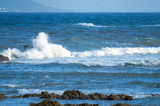 wave and rock in ocean