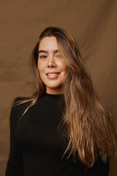 Young woman smiling with natural beauty and long hair