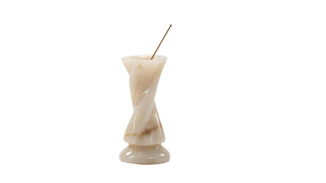 Carved alabaster stone incense holder with a thin wooden stick resting inside the twisted column structure isolated on a transparent background