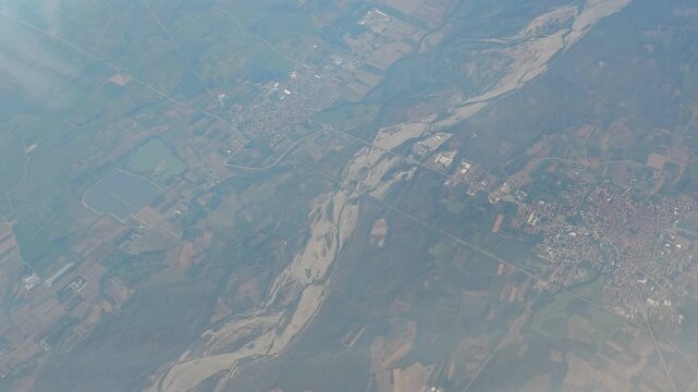 Aerial 4K video footage of drought-stricken Europe seen from above, showing major European rivers severely dried up by extreme drought, exposed riverbeds and the effects of climate change