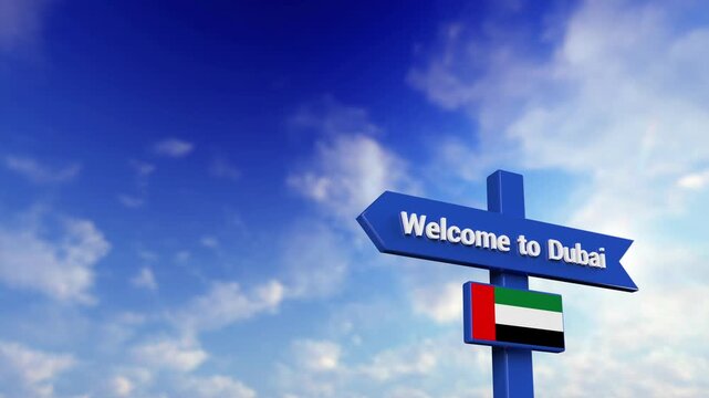Blue Directional Road Sign with Welcome to Dubai Text and UAE Flag Under Blue Sky