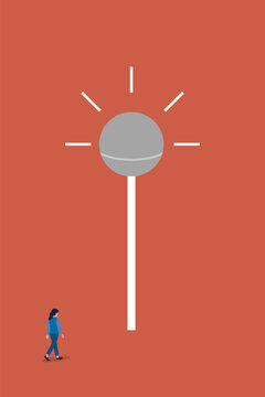 Business woman approaches a large, glowing lollipop-shaped light, symbolizing the successful pursuit of a creative business idea