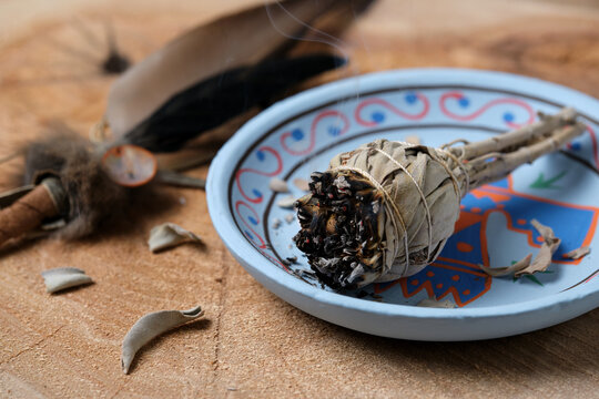 White Sage Smudge Stick on Blue Decorative Plate with Feather