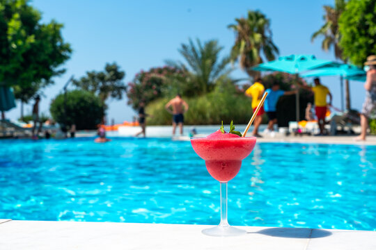 Panorama of refreshing strawberry Daiquiri by a Sparkling Poolside on a Sunny Day with a vibrant taste