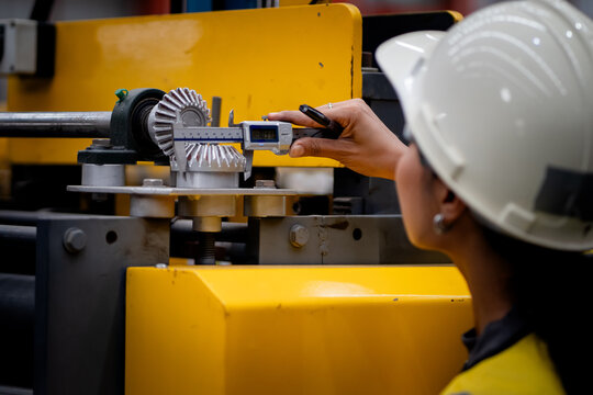 Happy women engineer worker enjoy working in factory industry.