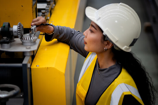 Happy women engineer worker enjoy working in factory industry.