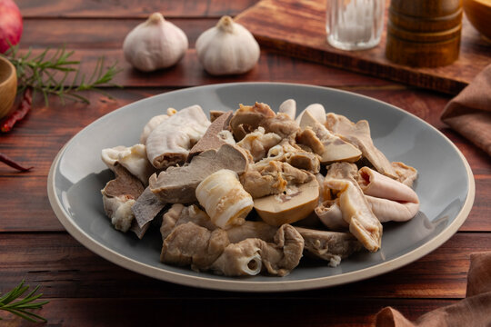 Pork Giblets or Pig Offal in a plate.Boiled Mixed Pork Offal ,Intestines ,Guts ,Chitterlings ,Heart ,Kidney ,Liver ,Spleen and Lung.