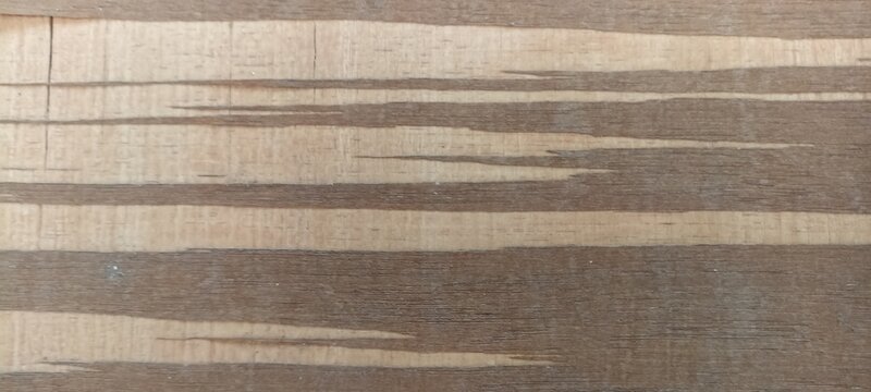 Wooden texture background featuring alternating light and dark grain layers, ideal for timber product design, rustic banners, carpentry themes, and natural surface backdrops
