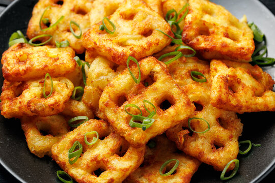 Hash Brown Waffles with Spring Onion on black plate