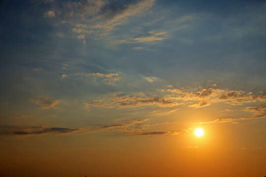 dramatic sunset in the sky with clouds