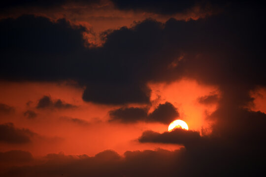 dramatic sunset in the sky with clouds