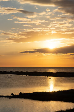 Golden hour at the Besser Rev with sunrays and dramatic sky, Samsoe, Denmark