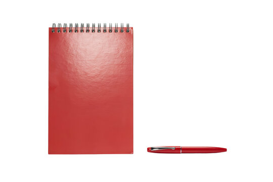 Red spiral bound notebook with a matching red ballpoint pen placed on a clean white surface isolated on a transparent background