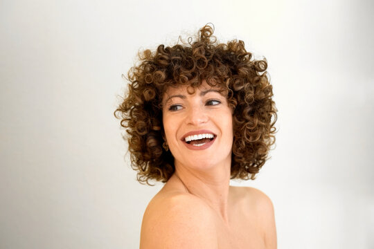 Lively woman portrayed with spontaneous and joyful demeanor reflecting her spirited nature