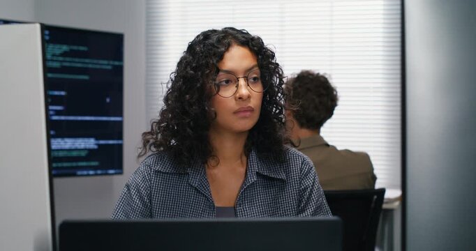 Computer developer drafts and selects a rollback plan before executing a risky production change.