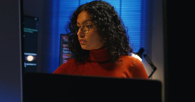 Computer programmer reviews logs and selects the safest deployment window to minimize user impact.