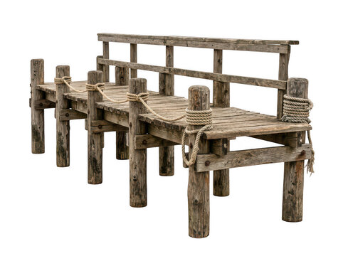 Old rustic wooden dock pier bridge made of textured timber planks and logs