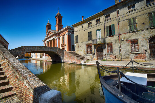 Ponte del Carmine across the Canale Maggiore with the Chiesa del Carmine (Church of Our Lady of Mount Carmel) in the background, Ferrara, Emilia-Romagna, Italy