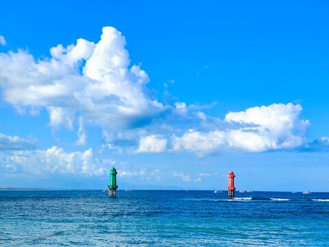Green and red navigational channel markers in the ocean, Indonesia