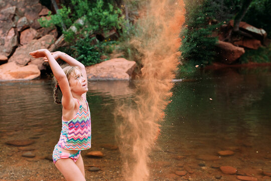 Child Throwing Sand 