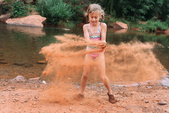 Child Throwing Sand