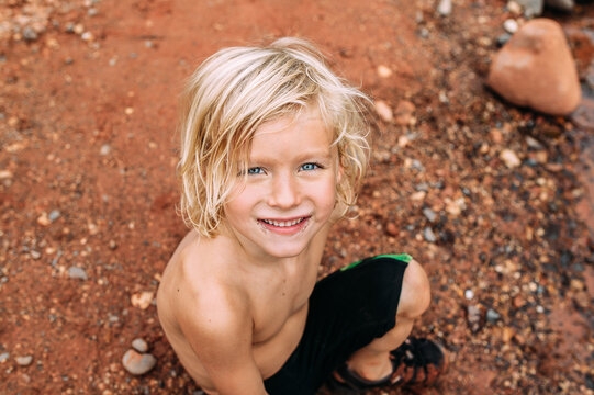 Boy on Red Sand Beach