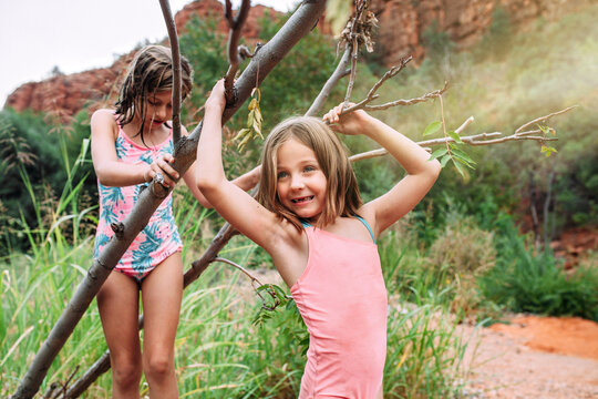 Young Girls Exploring Nature in Bathing Suits