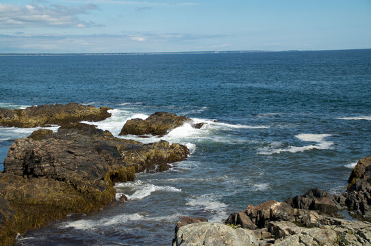 Rocky Coast Of Maine Looking at Atlantic Ocean with land in distance