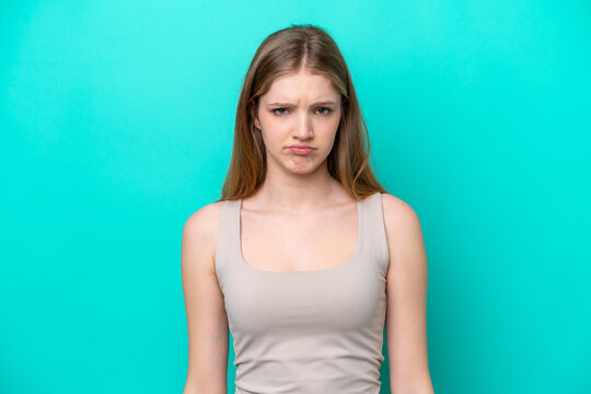 Teenager Russian girl isolated on blue background with sad expression