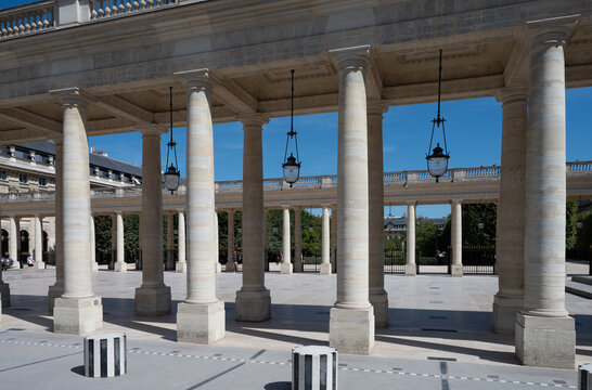 Columns and inner courtyard of the Palais Royal in Paris, France, on a sunny summer day