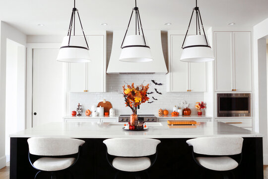 Beautiful modern black and white kitchen with Halloween cookware and decor display
