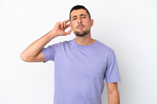 Young handsome caucasian man isolated on white background having doubts
