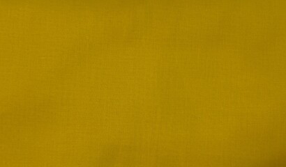 Fototapeta premium Mustard yellow fabric textile texture background, suitable for design, web usage, and creative projects.