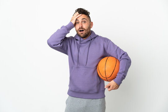 Basketball player man isolated on white background with surprise expression