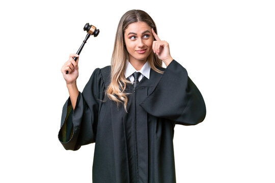 Judge Uruguayan woman over isolated background having doubts and thinking