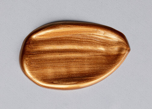Gold metallic paint smear brushstroke texture