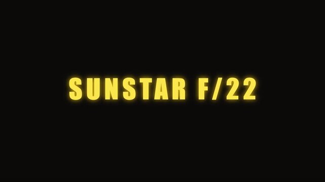 Sunstar f/22 concept: glowing yellow text overlay with geometric starburst on animation 4k black background