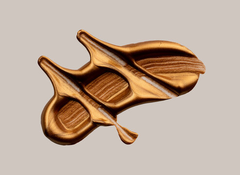 Metallic bronze gold paint smearing abstract texture