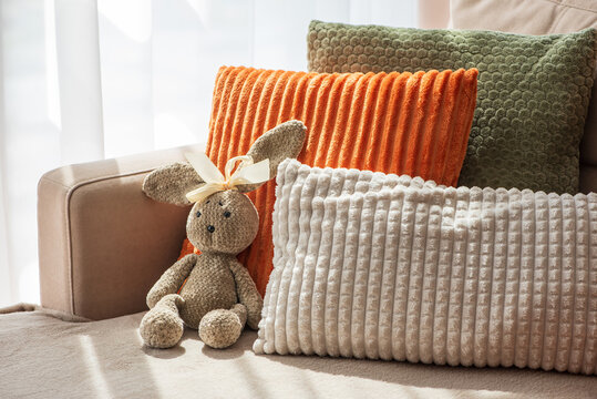 Cozy Home Scene With Plush Pillows And Adorable Stuffed Bunny For Comfort And Relaxation Ambiance