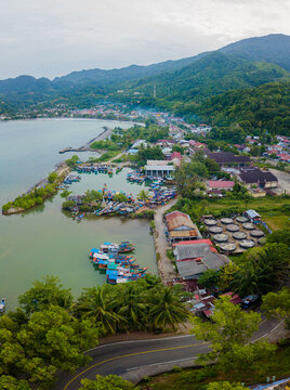Aerial drone view of amazing island coastal scenery with blue sea water at Tapak Tuan, Aceh, Indonesia