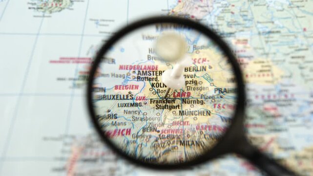 Exploring places on a detailed map with a magnifying glass in focus