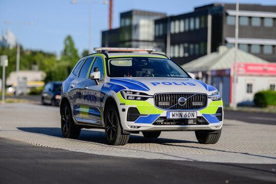 Gothenburg, Sweden - July 20 2026: Swedish Volvo XC60 police SUV parked beside modern city road.