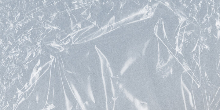 Transparent plastic wrap texture, wrinkled cellophane film background, clear polyethylene stretch foil for packaging mockups