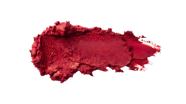 Bright red lipstick smear or makeup texture swatch isolated on a plain surface