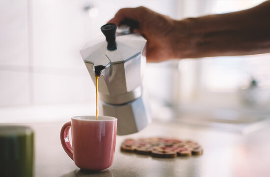 Fresh Coffee Pouring from Moka Pot