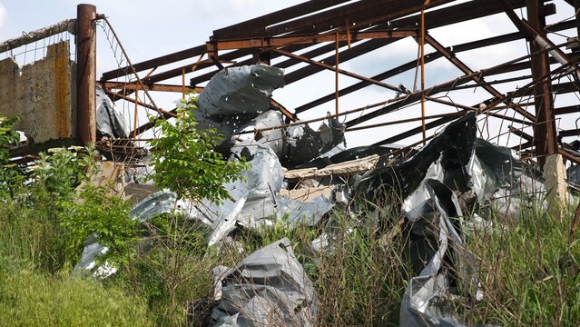 View to destroyed residential buildings at Kharkivska oblast. Ruined houses after bomb attacks on ukrainian territory from russia army. Consequences of russian invasion of Ukraine. Slow motion