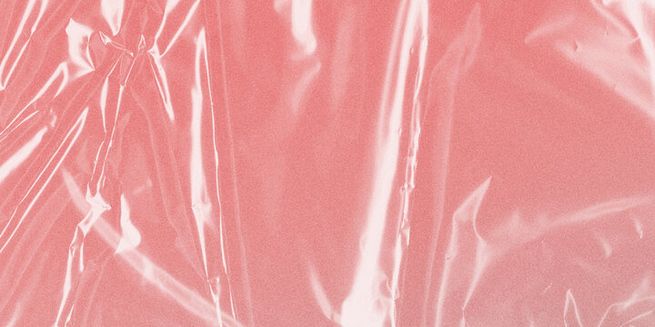 Pink plastic wrap texture, wrinkled cellophane film on rose background, glossy transparent polyethylene overlay for design mockups
